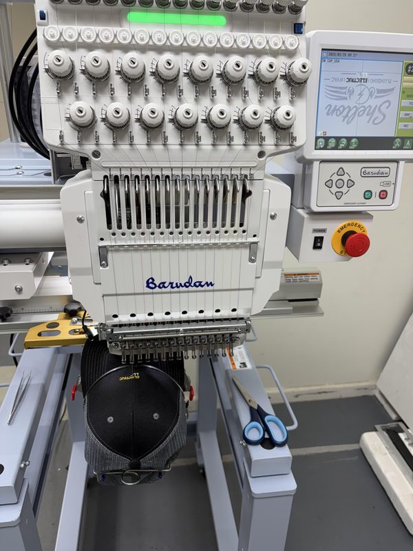 In-house embroidery machine Barudan professional embroidery machine embroidering custom hats in-house at BuckWholesale Suwanee GA warehouse